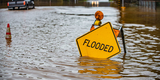 A road sign in Pescadero saying 'Flooded'